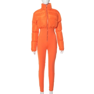 Detailed view of women's orange high-collar puffer jumpsuit with zipper closure