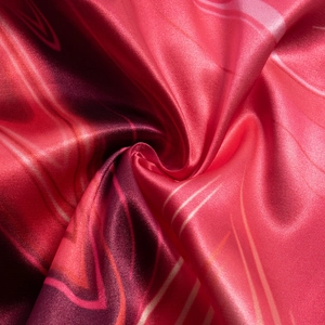 Detailed macro shot of silky satin fabric showing vibrant purple fluid textures and glossy finish
