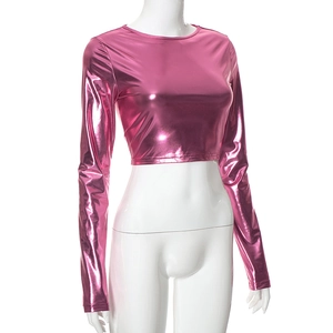 Detail showing metallic pink crop top with a glossy finish and long sleeves