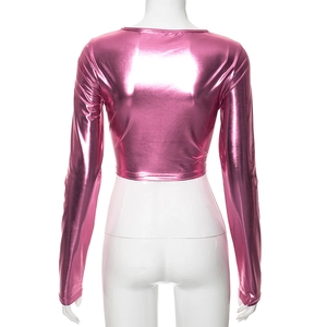Back view of a metallic pink long sleeve crop top with shiny reflective finish and slim fit
