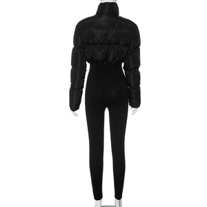 Back view of slim fit black quilted puffer jacket with high collar on mannequin