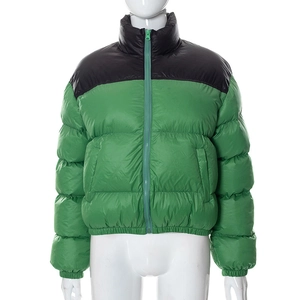 Detail of the high-collar windproof design and color-block zipper of the green padded jacket