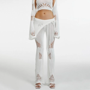 Detailed knit texture of white crochet bell sleeve top and hollowed-out pants set