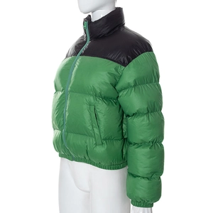 Detail of green puffer jacket with black shoulder panels and stand collar design