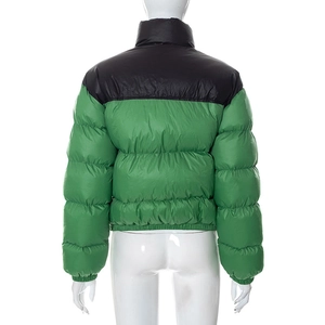 Back view of short puffer jacket featuring black and green color block and stand collar
