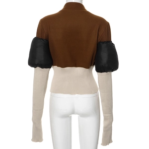 Detailed back view of a tricolor patchwork slim-fit jacket with puff sleeves and rib knit hem