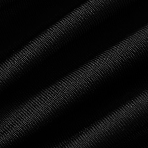 Makroaufnahme der schwarzen Stofftextur mit detaillierten diagonalen Rippstreifen