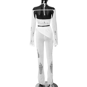Detail view of the white knitted four-piece set featuring cutout back and distressed texture