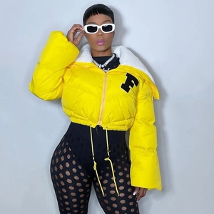 Detail of yellow puffer jacket with fuzzy fleece collar and F varsity letter patch