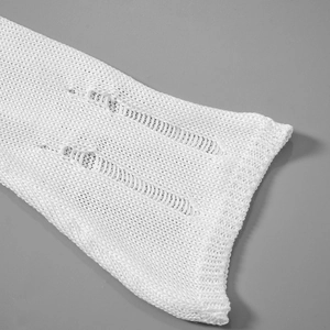 Detailed knit texture with ripped cutout design and ribbed cuffs on white sleeve