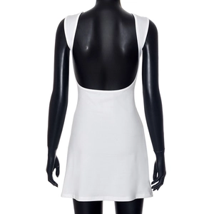 Close-up of white backless mini dress with deep U-shape design on black mannequin