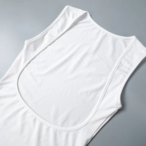 Detail of the white sleeveless top showing backless U-neck and elastic ribbed fabric