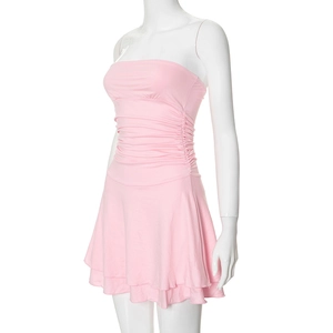 Detail of light pink strapless mini dress featuring dense pleats and layered hemline