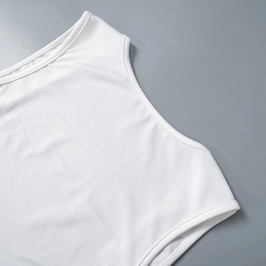 Detailed close-up of the double-needle stitching on white sleeveless dress shoulders