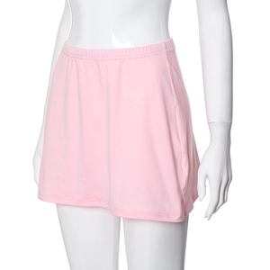 Detail of pink elastic waistband and side slit on the stretch knit mini tennis skirt