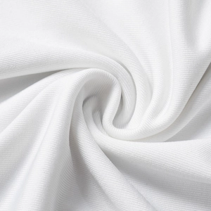 Detail of white breathable knitted fabric with a fine honeycomb mesh texture and soft pleats