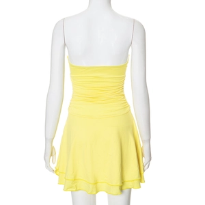 Detail showing back pleats and double ruffle hem of yellow strapless mini dress