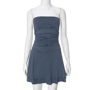 Detailed view of dark blue ruched strapless dress with layered hem and slimming fit