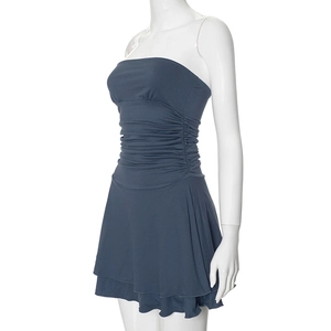 Detail view of the elegant navy blue strapless dress with ruched waist and ruffled hem