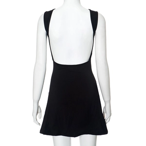 Detail of a black backless dress showing deep U-cut and flared A-line silhouette