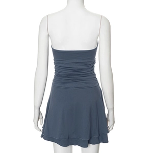 Detail view of the back of navy blue strapless dress with ruched waist and layered hem