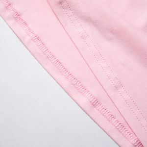 Close-up of pink knitted skirt featuring professional double-needle hem stitching detail