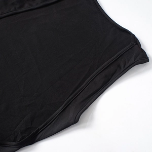Close-up of black sleeveless dress showing neat stitching and knitted fabric texture
