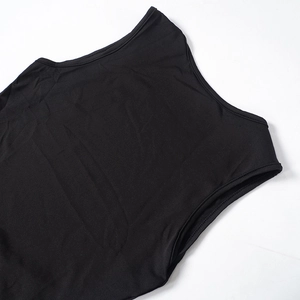 Detail shot of black sleeveless dress neckline with fine edge stitching on ribbed fabric