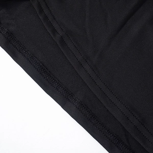 Detail of black knit fabric showing premium double-needle stitching and high elasticity