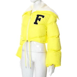 Detail of yellow puffer jacket showing white shearling collar and black F letter embroidery