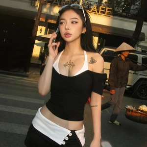 Slim fit backless crop top with black and white contrast halter design and ribbed detail