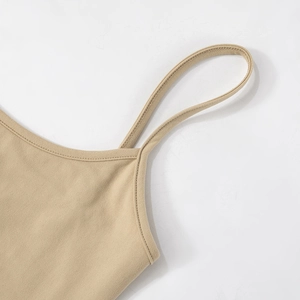 Detailed close-up of slim shoulder straps and neckline on earth-toned maxi dress