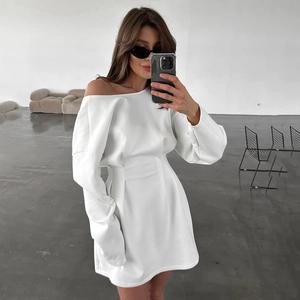 Minimalist white long-sleeve off-shoulder dress with gathered waist and asymmetric neck