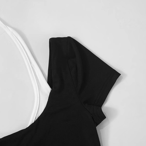 Close-up of contrast black and white layered neck design and stitching on top