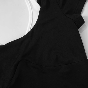 Detail shot of black and white contrast stitching on casual backless crop top