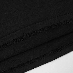 Detail of the high-quality double-needle stitching on the black knit crop top hem