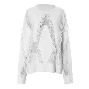 Detailed view of white knit sweater with star-shaped fringe and distressed hollow out patterns