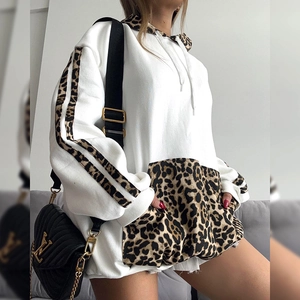Oversized white hoodie with leopard print sleeves and hood, casual streetwear style
