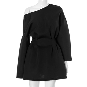 Detail of black one-shoulder long sleeve dress with waist pleats on white mannequin