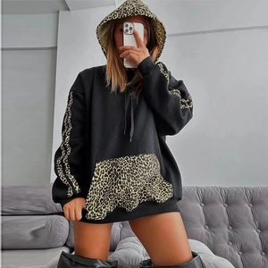 Women's oversized black hoodie with leopard print accents on sleeves and hood