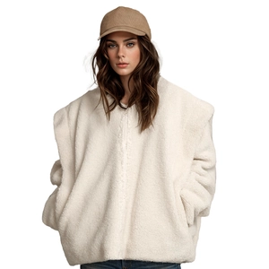 Detailed texture of off-white oversized sherpa jacket with cozy plush material and zipper