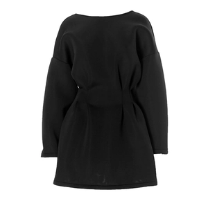 Detailed view of black mini dress featuring a pleated waist and structured cotton fabric