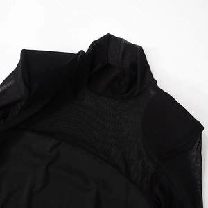 Close-up of black mesh patchwork detail and high collar stitching on slim-fit dress