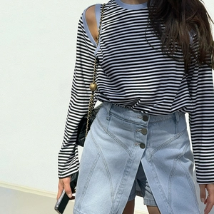 Striped off-shoulder long sleeve top with denim mini skirt outfit for a casual street look