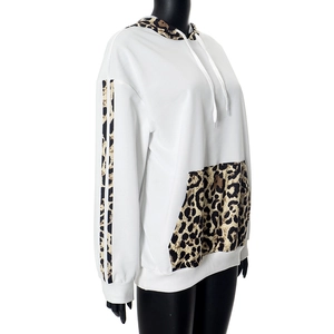 Detail view of leopard print trim on the hoodie sleeve and drawstring hood design