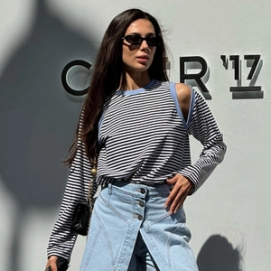 Striped off-shoulder knit top with blue trim and asymmetric denim mini skirt outfit