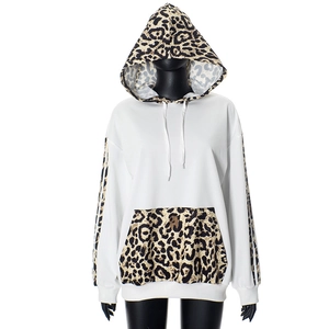 Detail view of leopard print contrast panels on hooded sweatshirt with white drawstrings