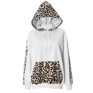 Detail of hoodie showing leopard print patchwork on the hood and striped long sleeves