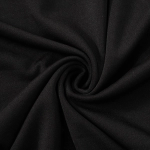 Close-up of premium black mesh fabric with soft drape and fine knit texture details