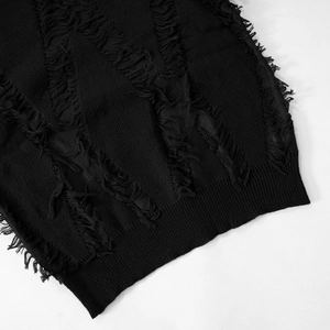 Close-up of black knit top featuring distressed ripped holes and fringe tassel hem details